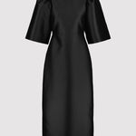 Black dress with puff sleeves on a light gray background