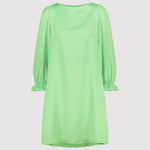 Mint green dress with long sleeves on a light gray background