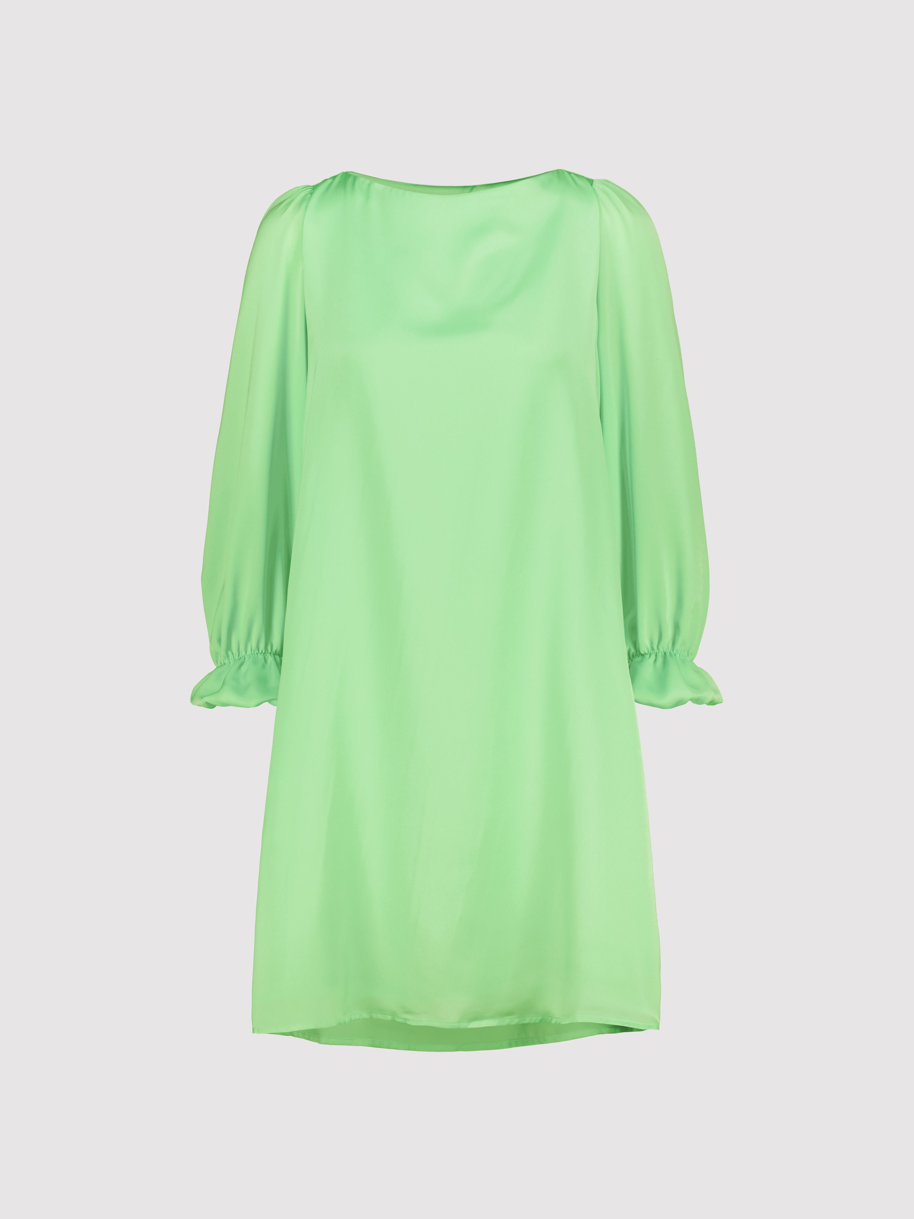 Mint green dress with long sleeves on a light gray background