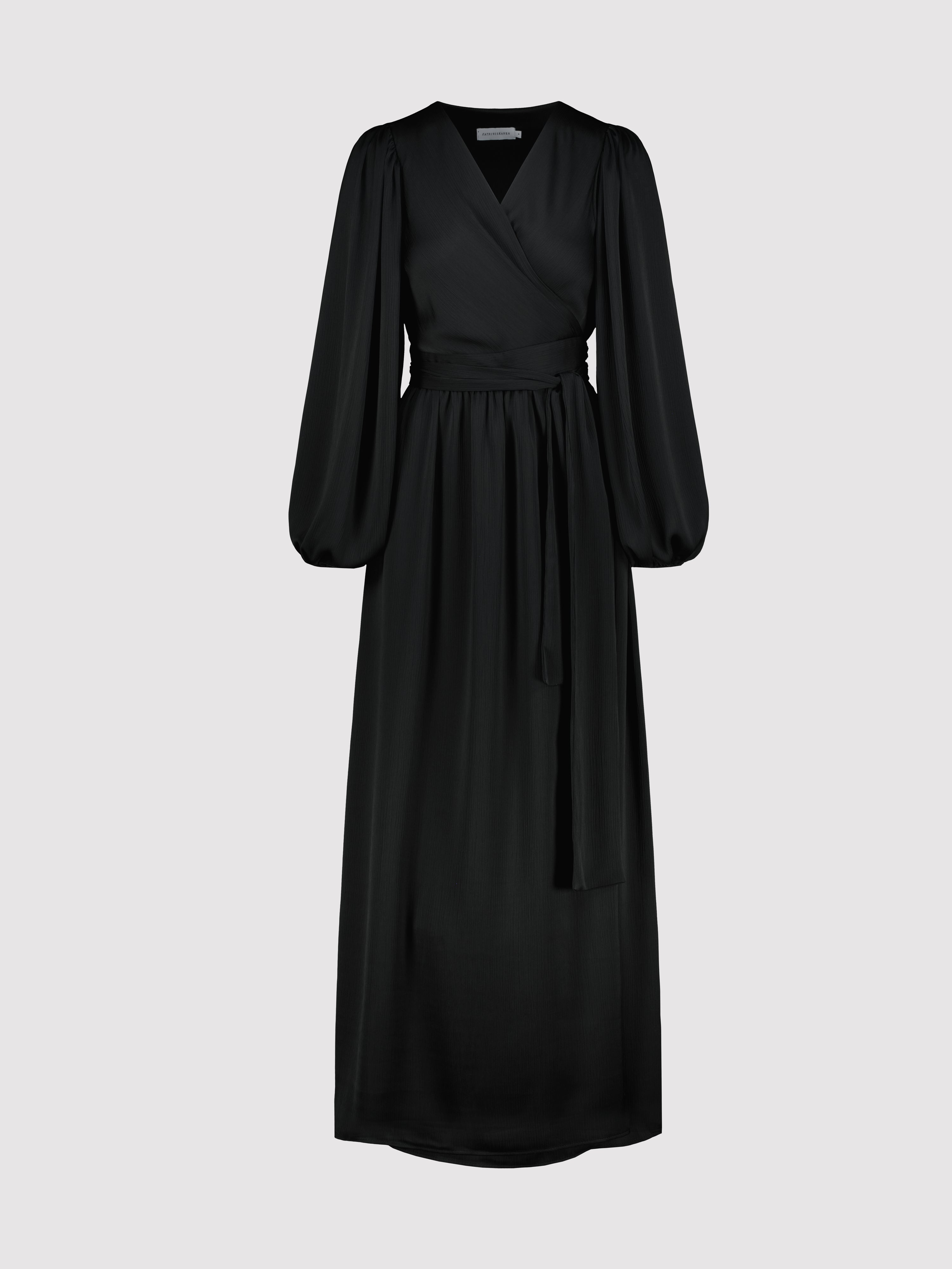 Black dress with long sleeves on a light gray background