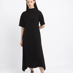 Woman wearing a black dress on a white background