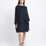 Woman wearing a black dress on a white background