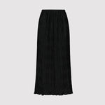 Black pleated skirt on a light gray background