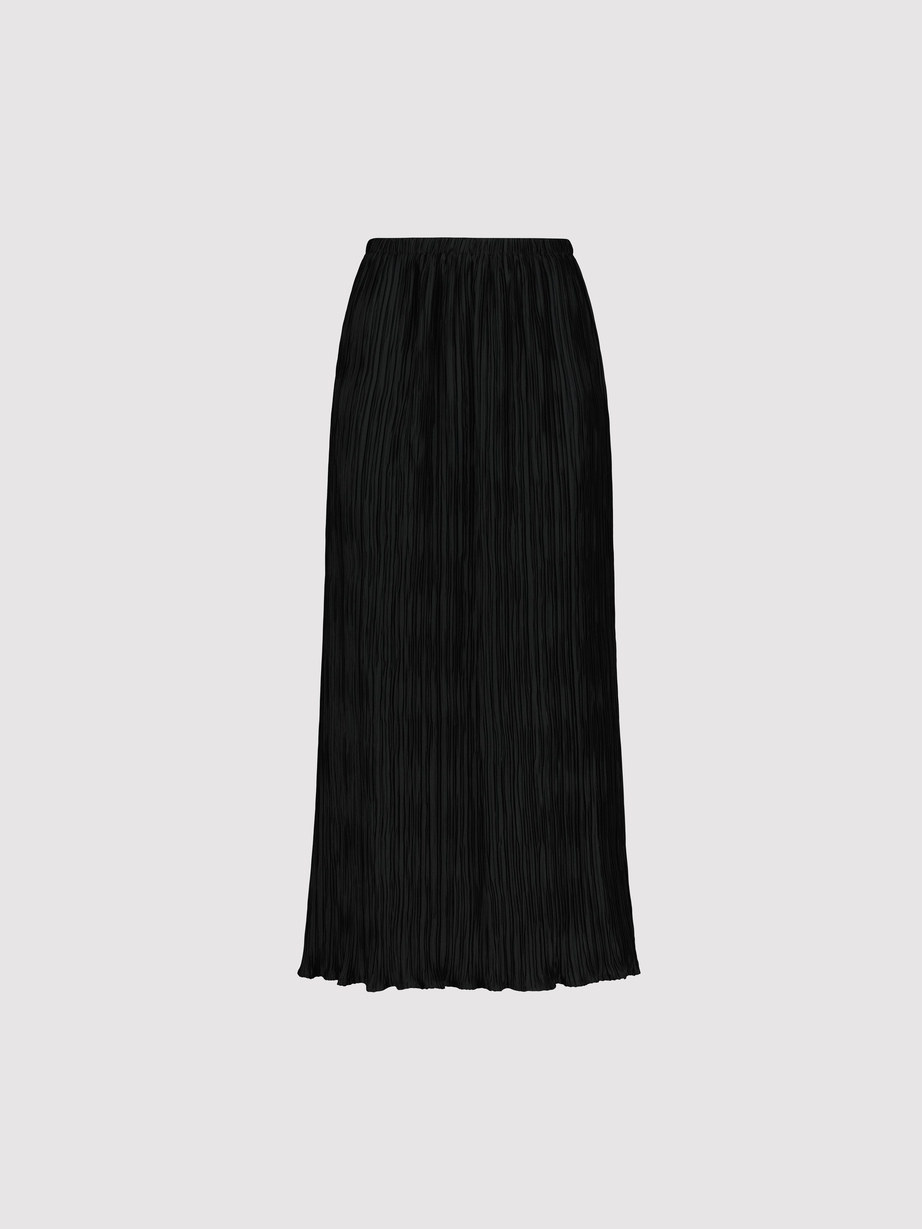 Black pleated skirt on a light gray background