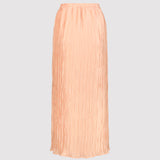 Peach pleated skirt on a light gray background