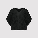 Black pleated blouse on a light gray background