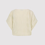 Beige plisse crop top on a light gray background